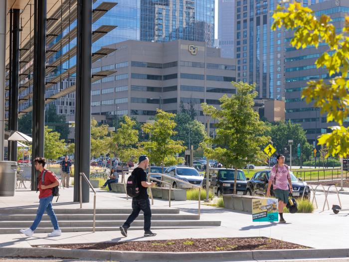 Students walking on sidewalk in Denver