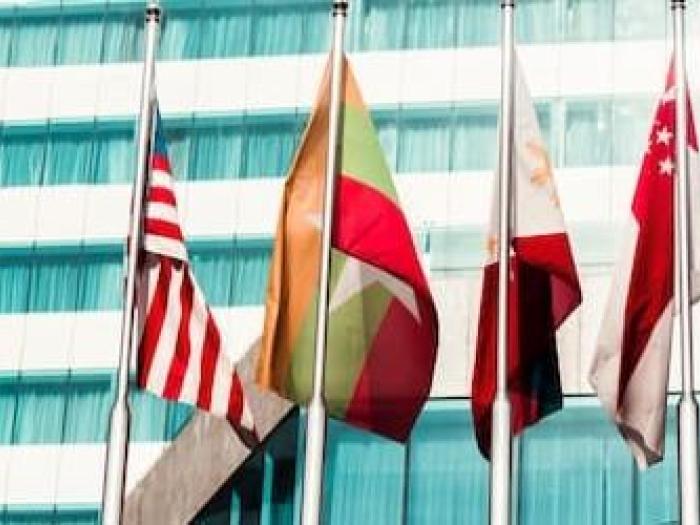 Different country flags in front of building