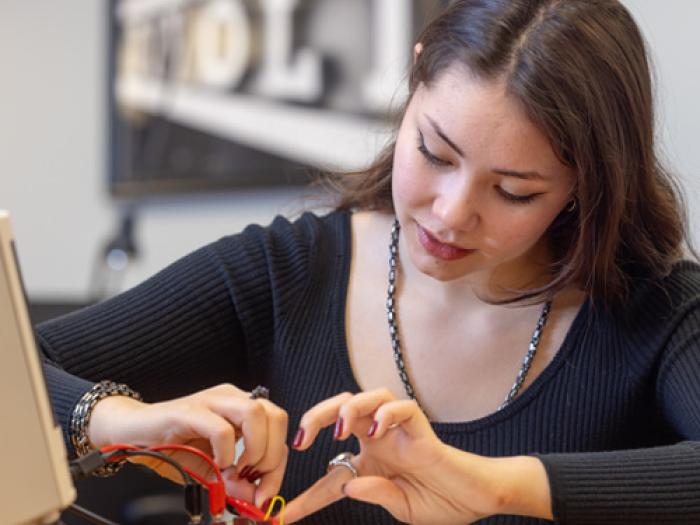 Student working on circuit in lab