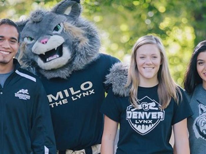 CU Denver students walking outside with Milo the Mascot