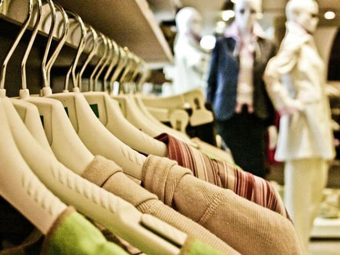 Close up of shirts on hangers in a store