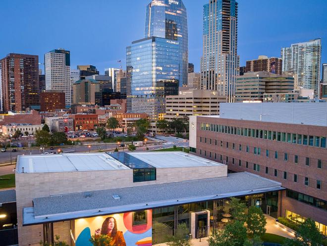 Aerial shot of CU Denver Learning Commons with city in background