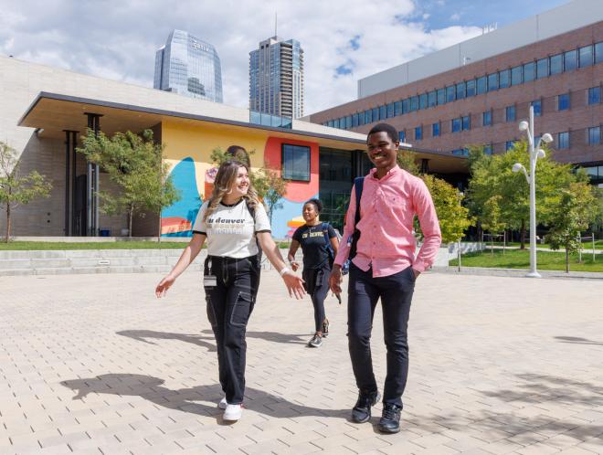 Students walking across Wellness & Recreation courtyard
