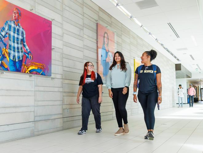 Three CU Denver students walking around campus