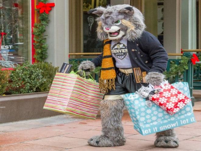Milo holding shopping bags