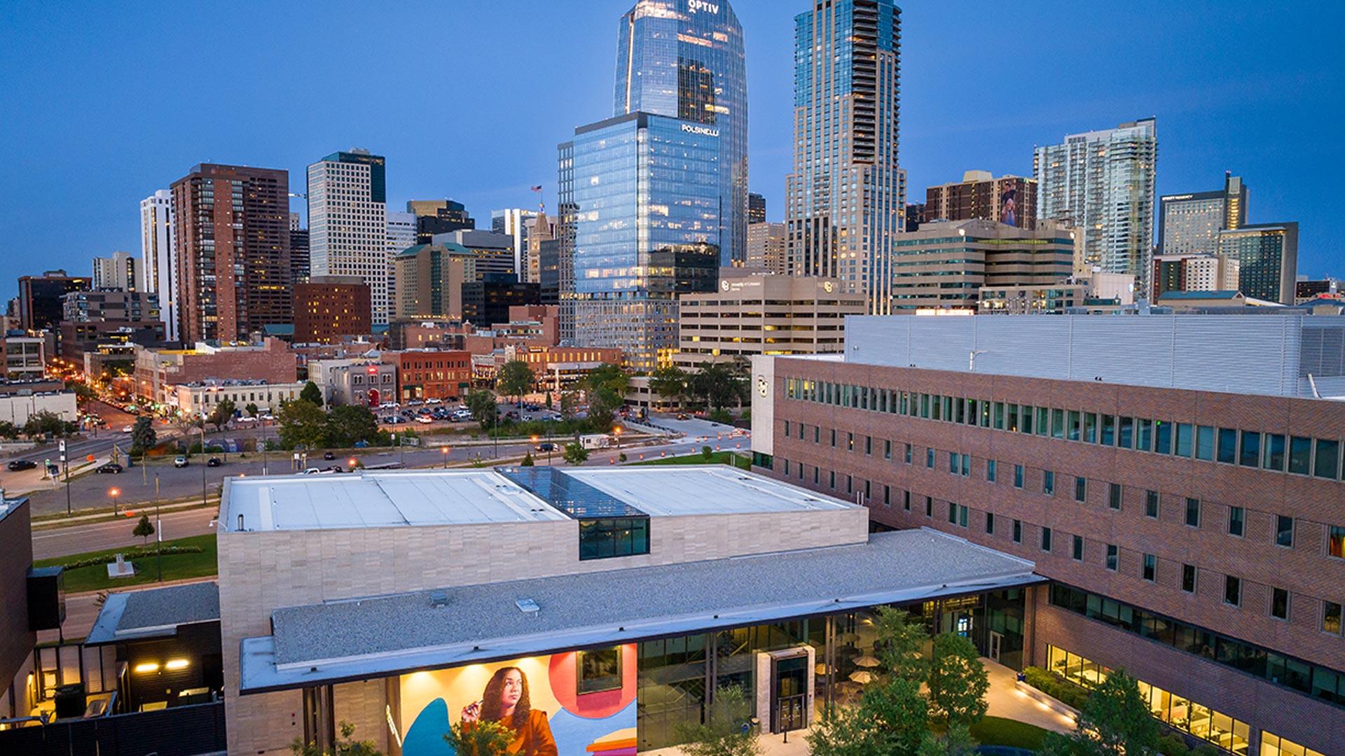 Aerial shot of CU Denver Learning Commons with city in background