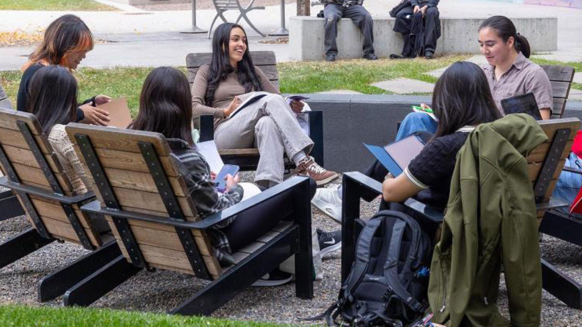 Circle of CU Denver students outside on campus