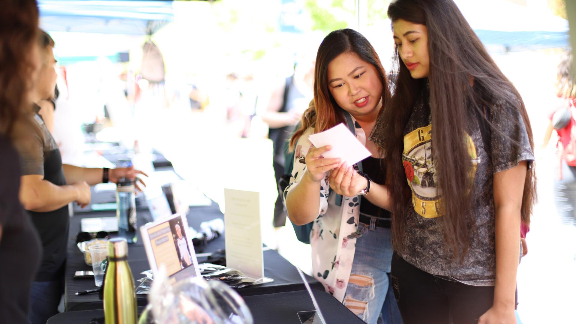 Students at sorority tabling event