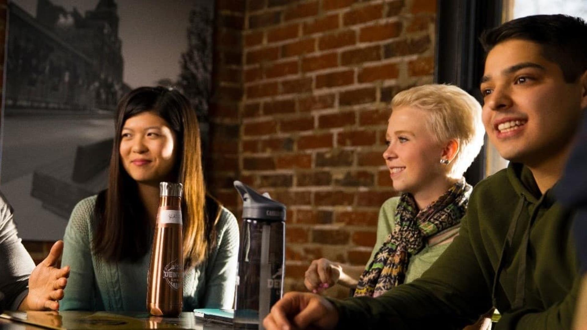 Students talking at a cafe