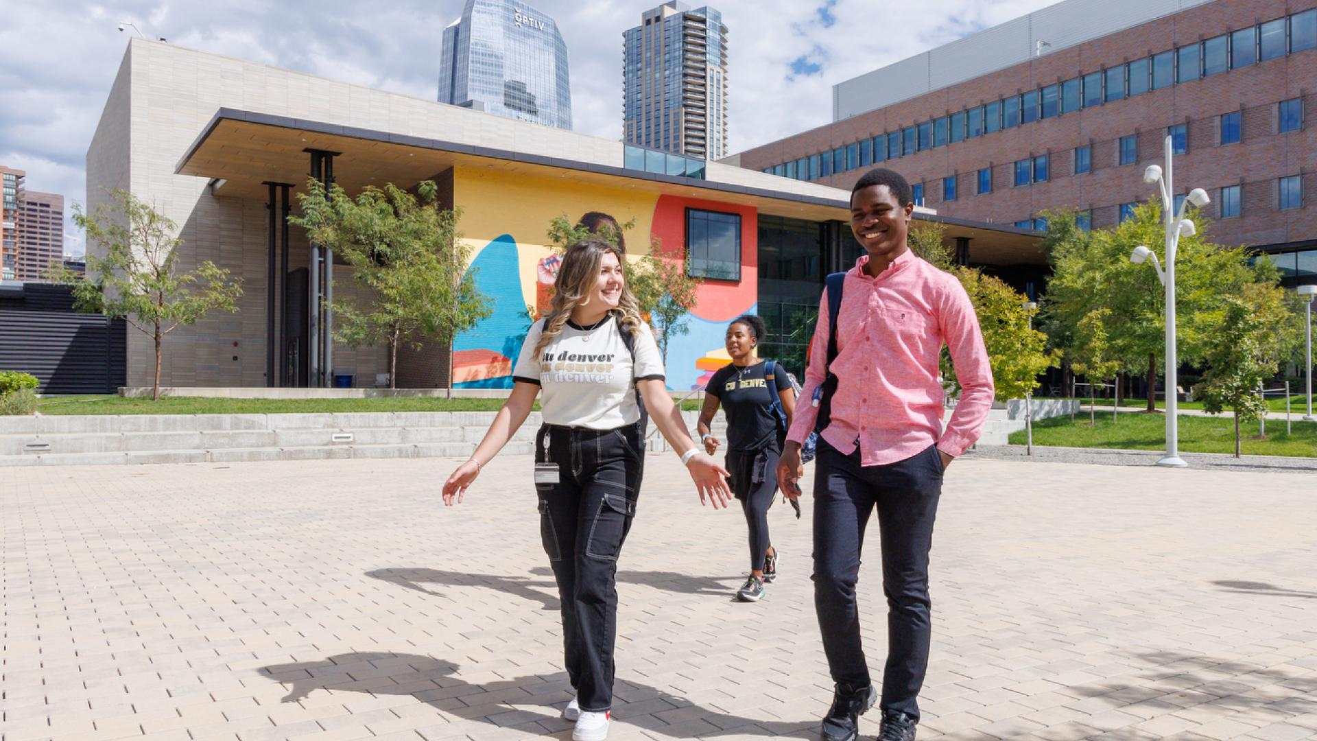 Students walking across Wellness & Recreation courtyard