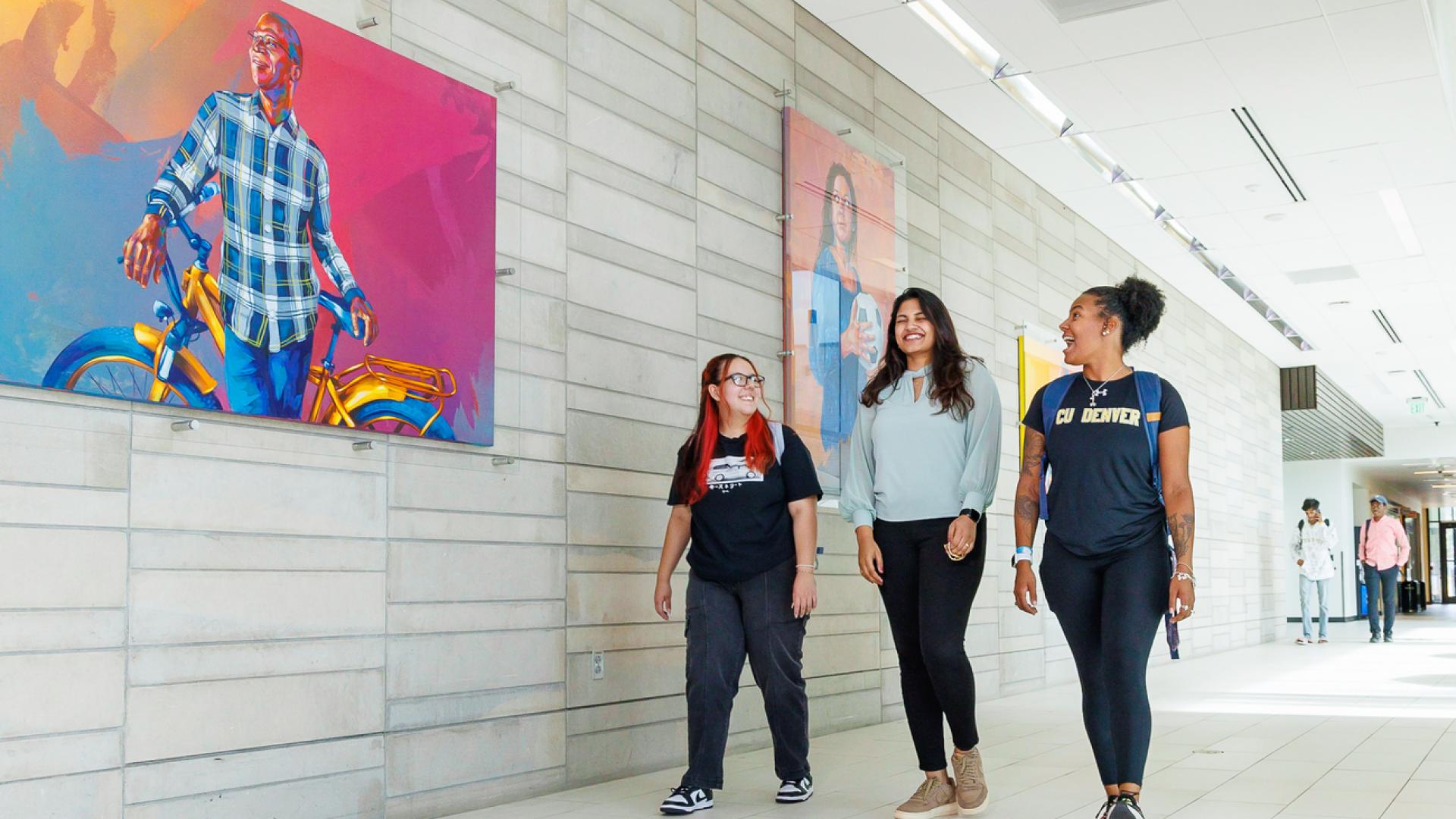 Three CU Denver students walking around campus