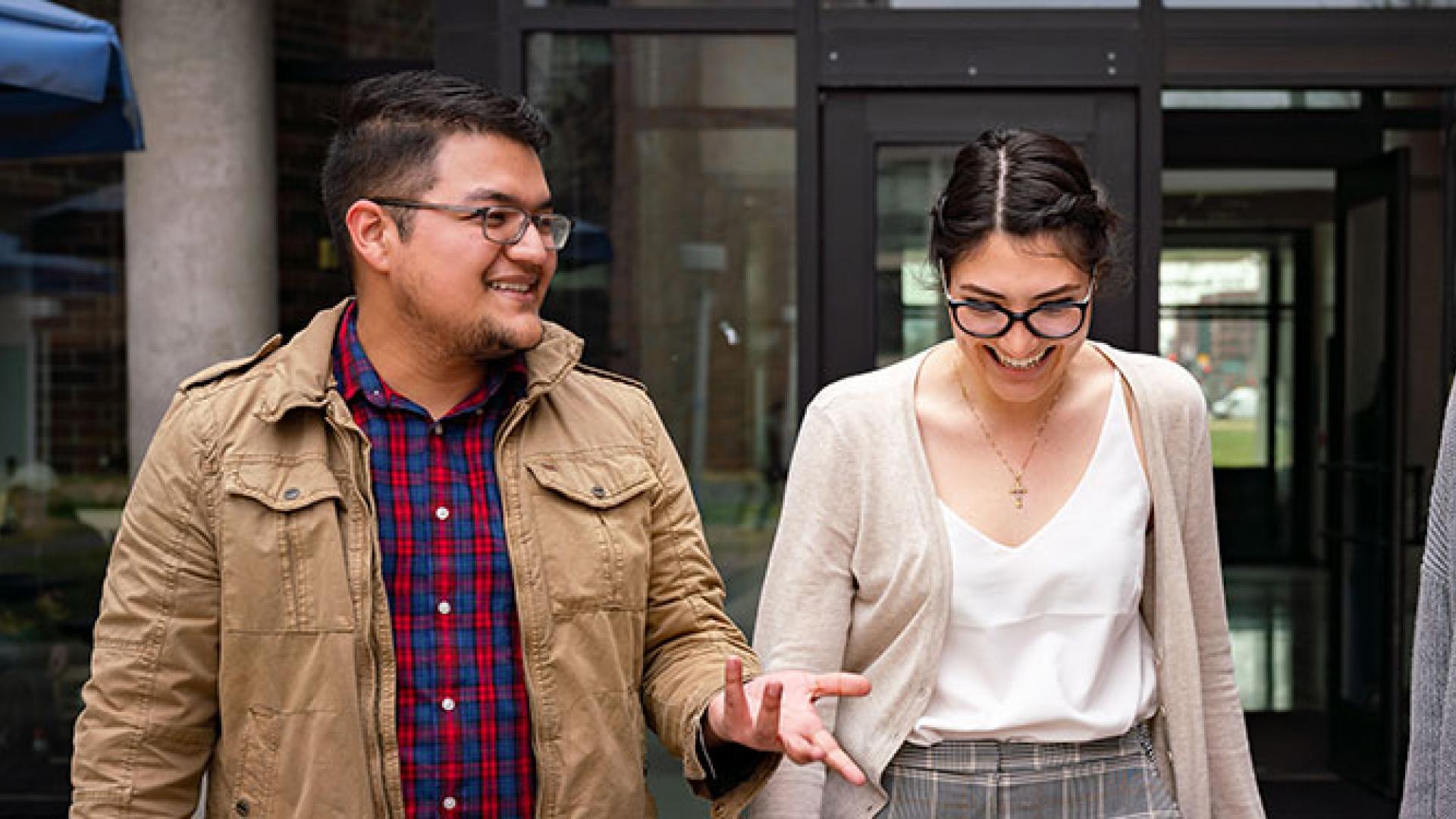 Three CU Denver students leaving building