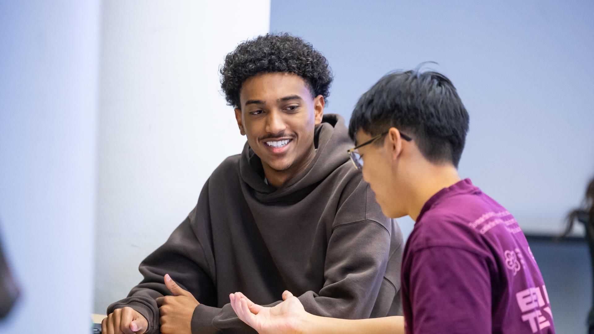 Two CU Denver students working in a classroom