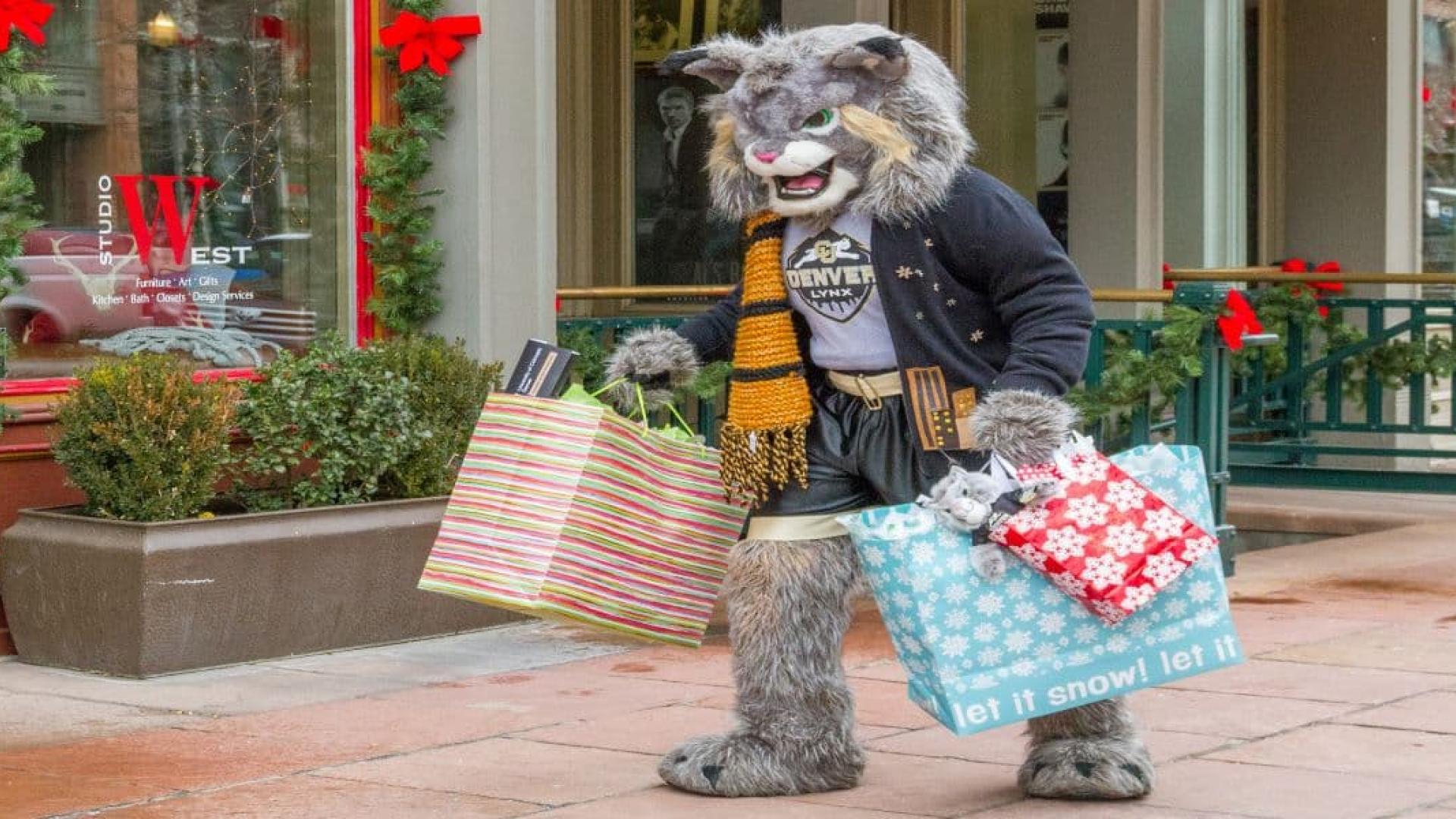 Milo holding shopping bags