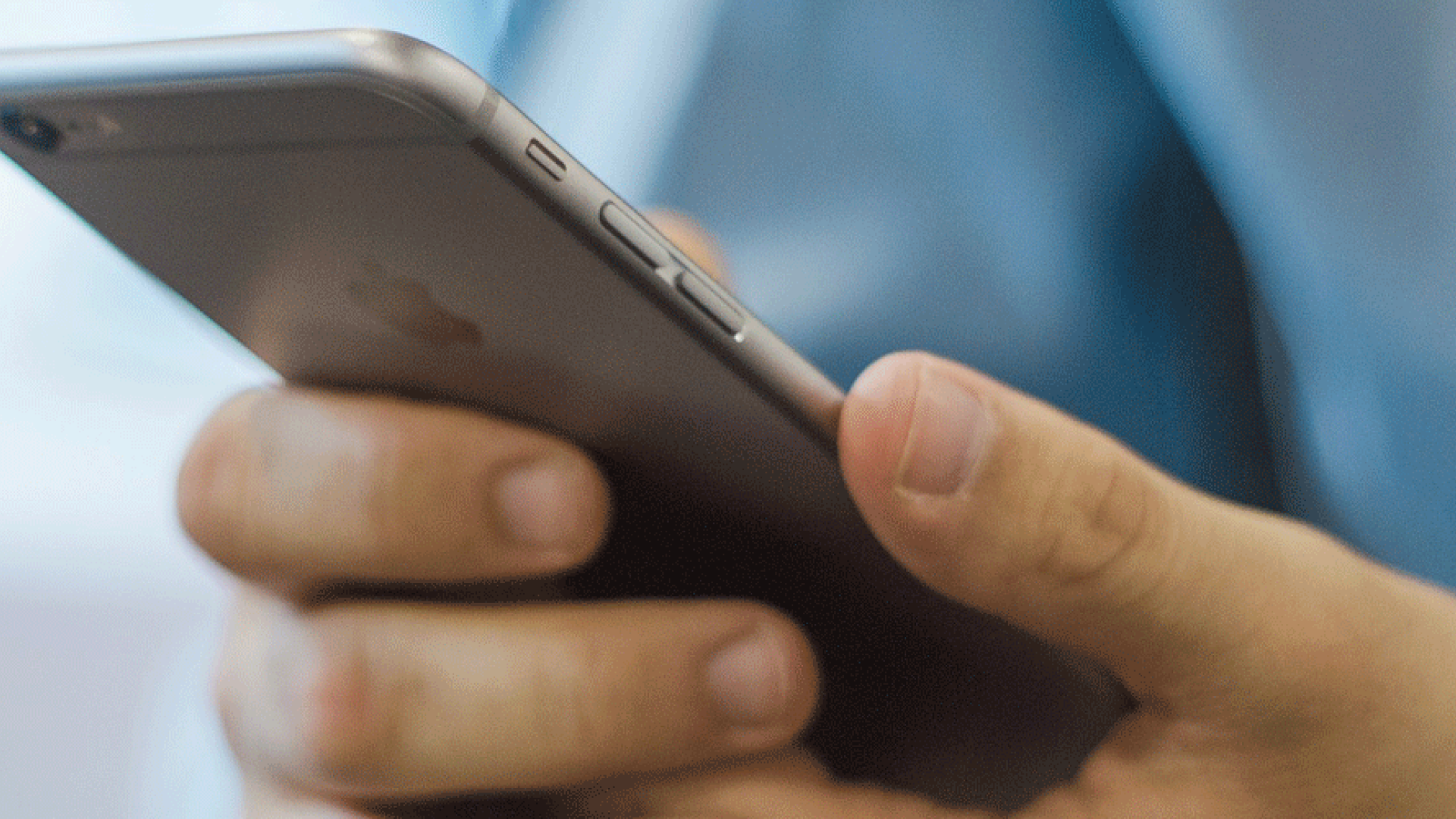 An image of a person holding a smart phone