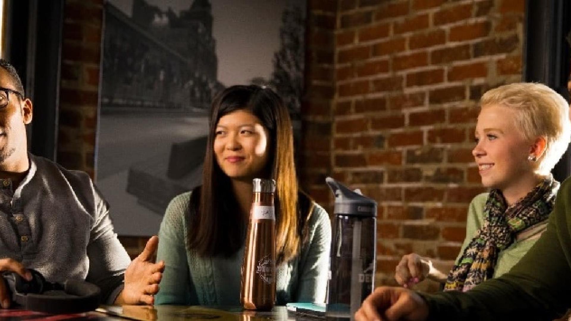 students talking at cafe