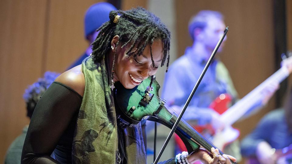 CU denvre student playing violin at concert
