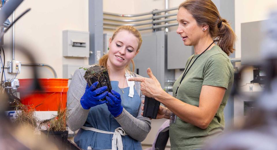 CU Denver student working in lab with professor discussing soil