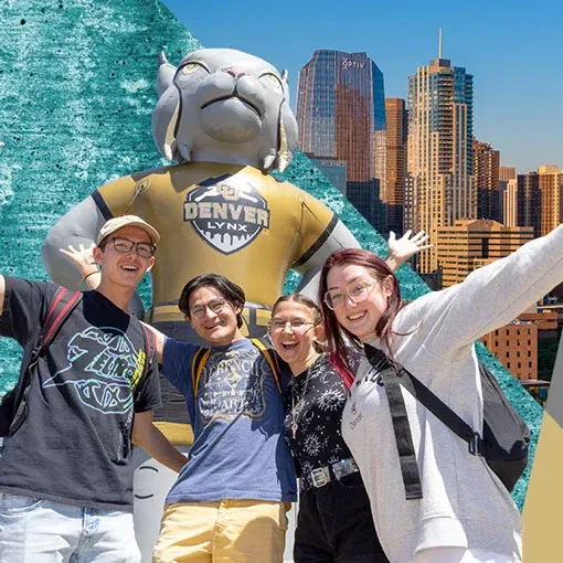 Group of 4 students standing in front of inflatable Milo 