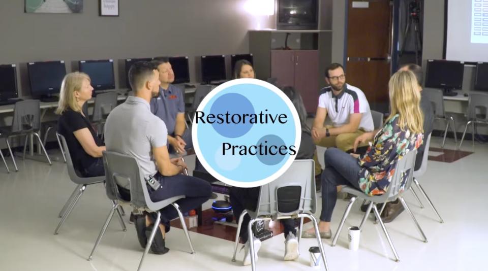 Teachers sitting in a Circle