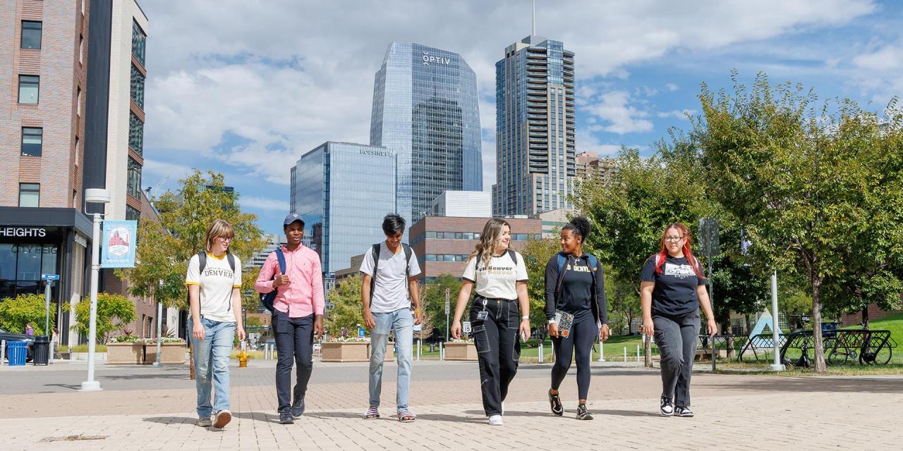Group of 6 CU Denver students walking around CU Denver's urban campus