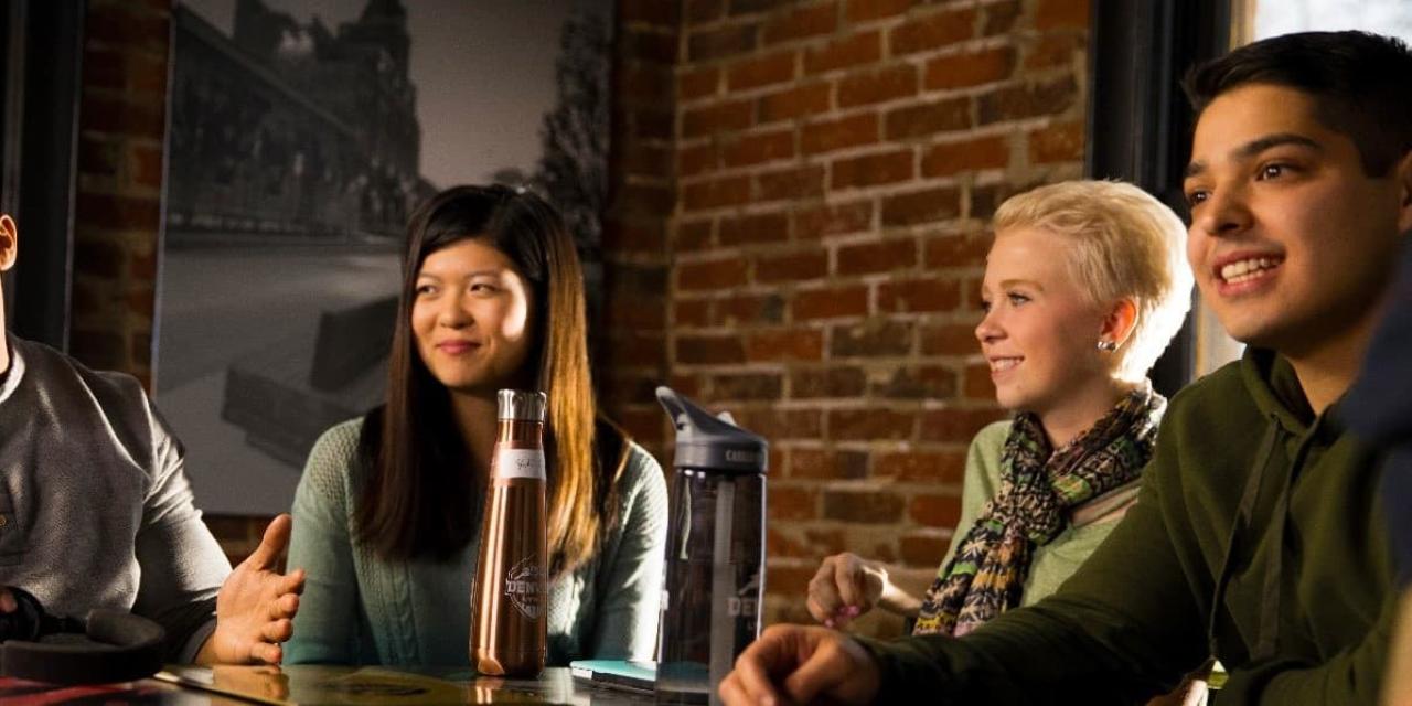 Students talking at a cafe