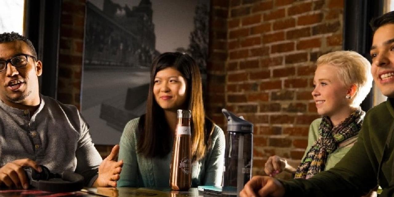 students talking at cafe