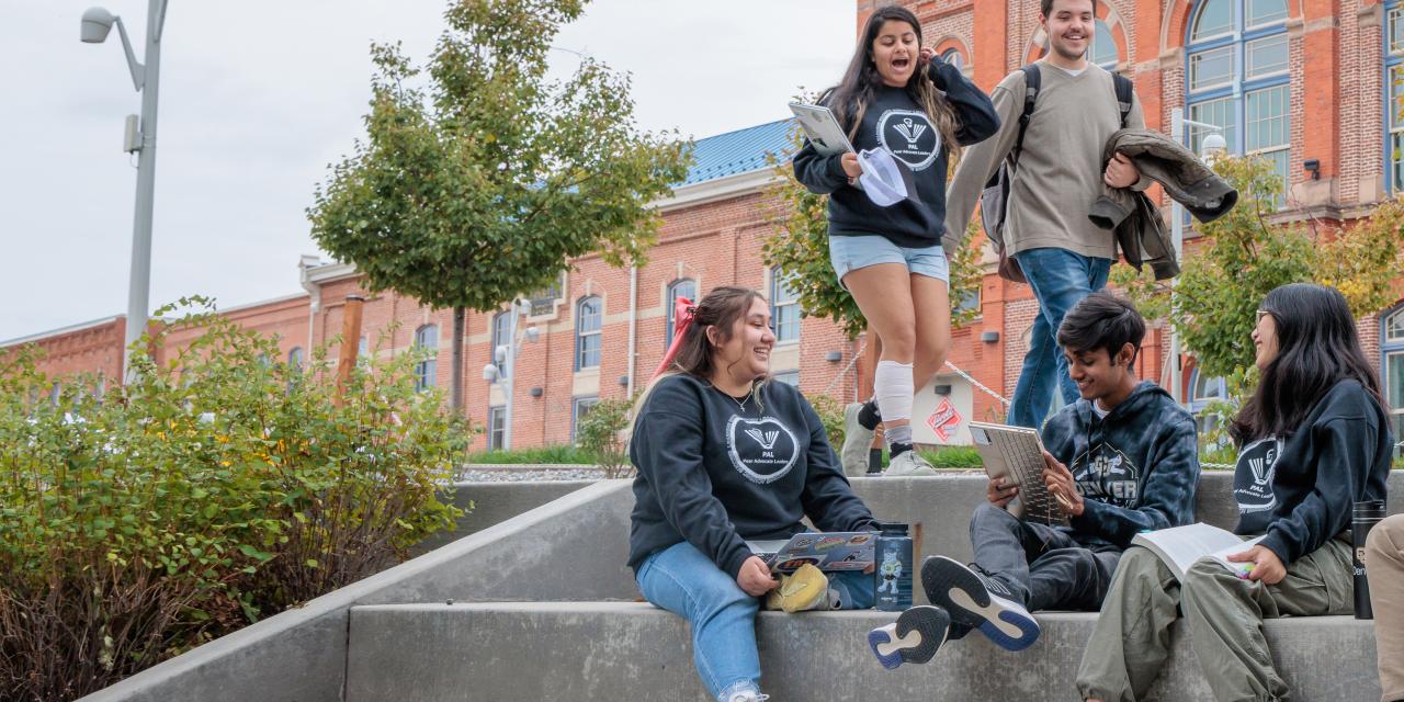 CU Denver students sitting and walking on campus