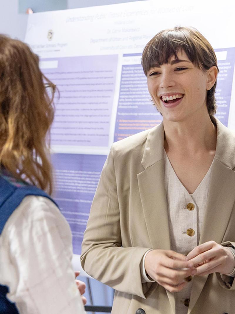 CU Denver student making presentation at conference