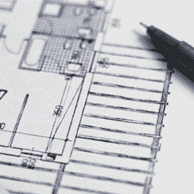pen resting on architectural drawing