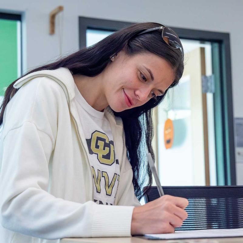 CU Denver student filling out paperwork