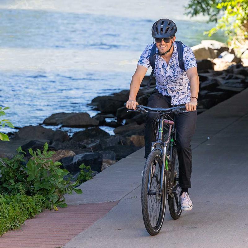 CU Denver student biking through Denver