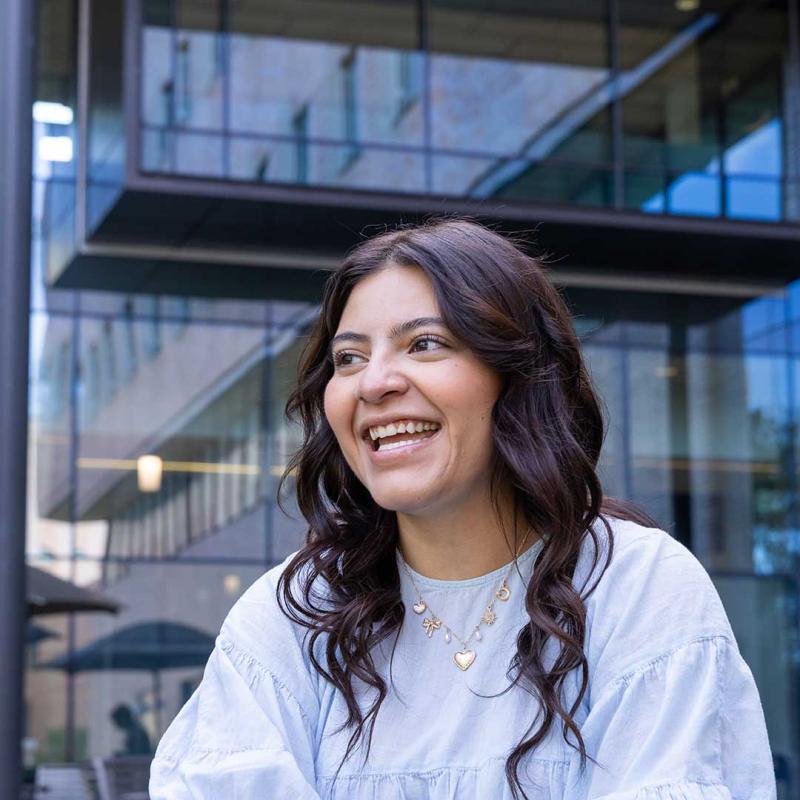 CU DEnver student smiling and looking away from camera
