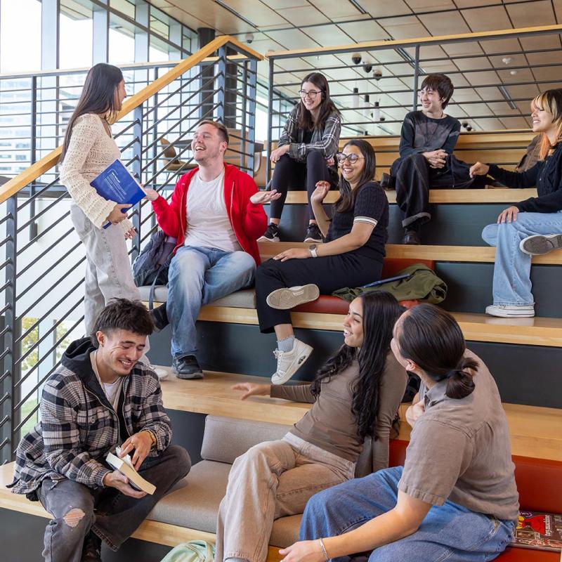 Group of CU Denver students sitting in student center talking
