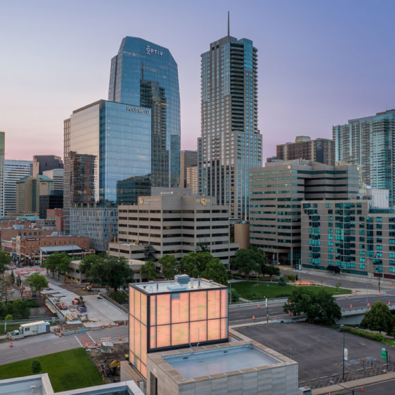 CU Denver campus buildings nestled between skyscrapers in downtown Denver
