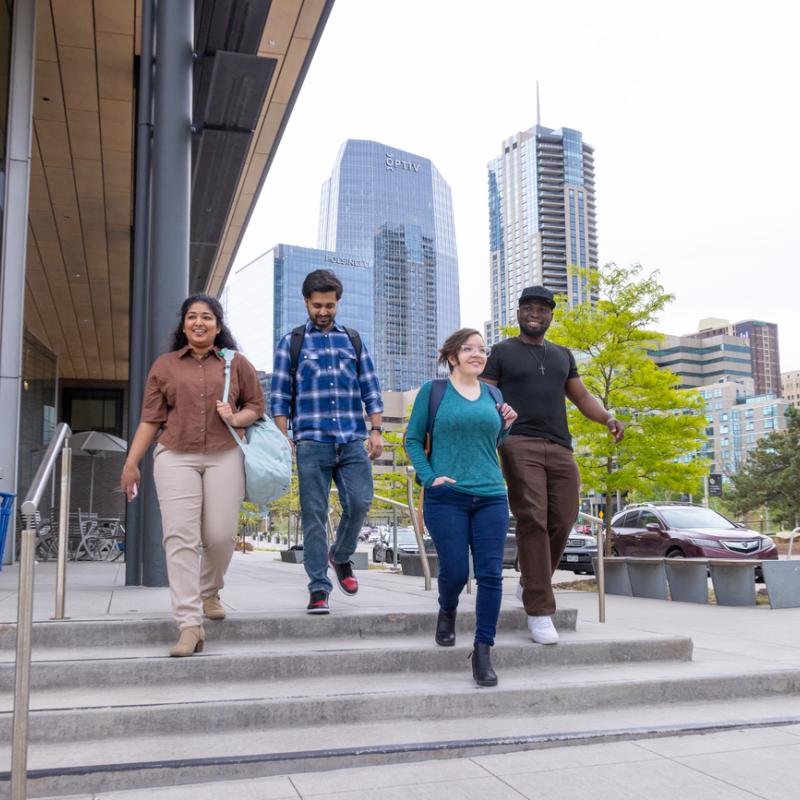 Students walking down stairs outside Student Commons Building
