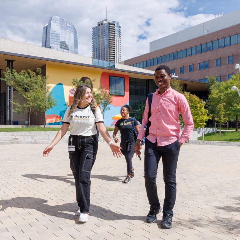 Students walking across Wellness & Recreation courtyard