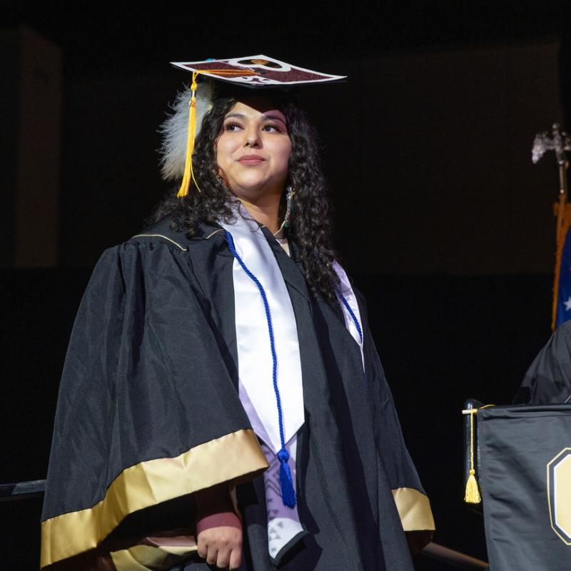 Student crossing the stage at Commencement